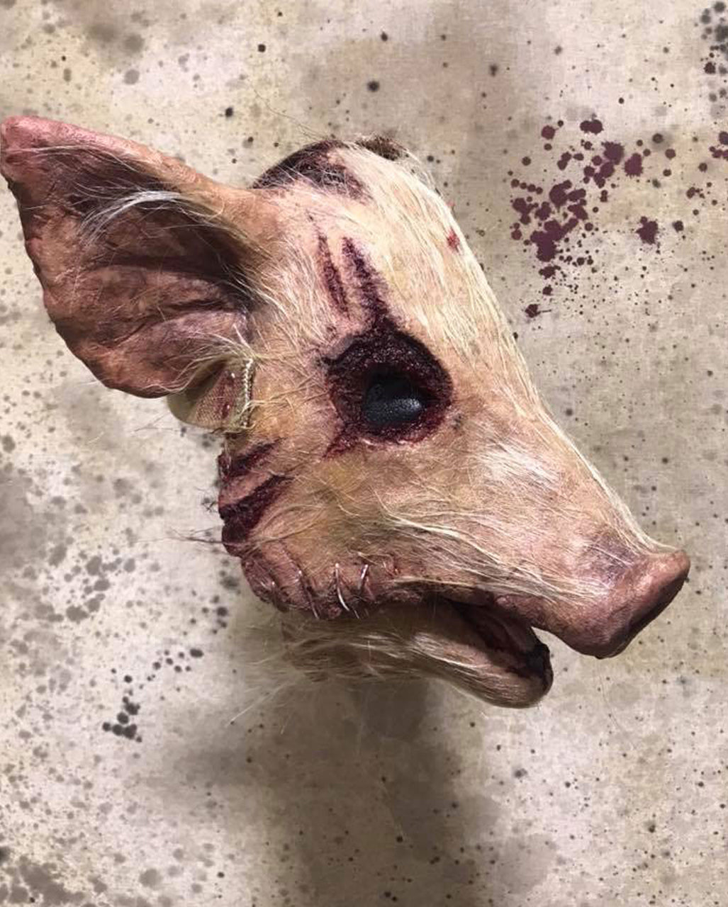 Behaarte blutige Schweinekopf Maske
